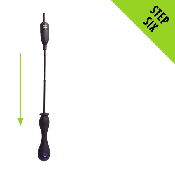 Hold the handle and gently pull the display handle down, reminding you not to light a fire with the Chimella in place.